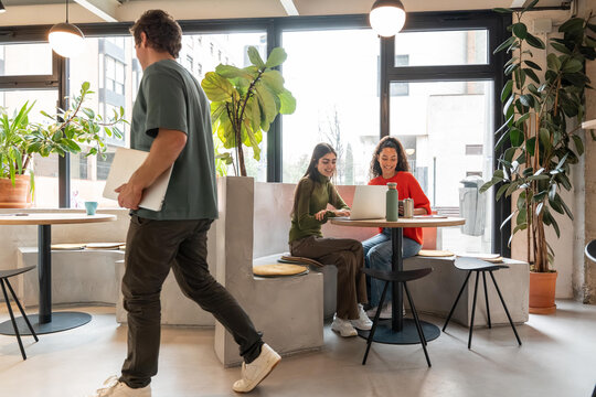 Multiethnic young professionals in modern coworking space