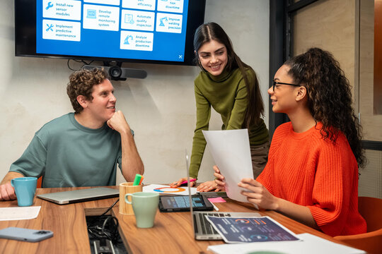 Multiethnic team collaborates in modern coworking space