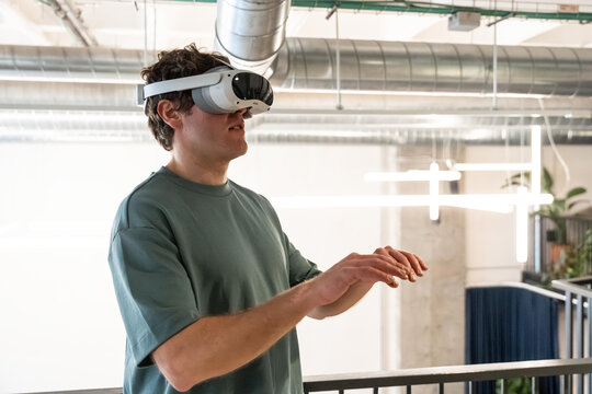 Man experiencing virtual reality in a modern workspace