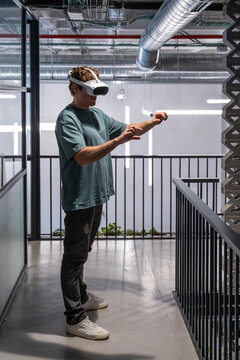 Man using virtual reality headset in modern space