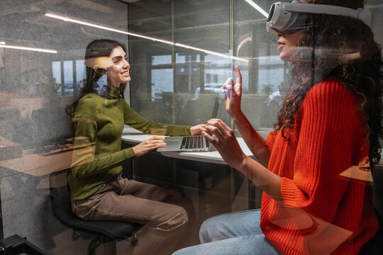 Multiethnic team embracing tech in a modern office