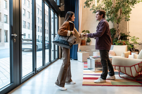 Coworkers meeting in modern office environment