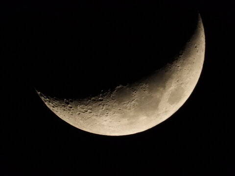 Detailed close-up of the moon captured with a super telephoto lens.
