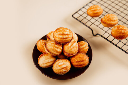 Oreshki cookies on a dark plate with cooling rack