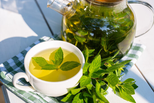 Fresh homegrown mint tea served in a white cup