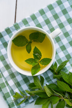 Freshly brewed homegrown mint tea in cup