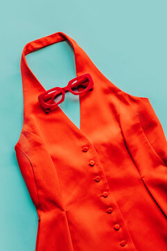 Vibrant red sundress with stylish red sunglasses