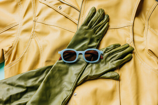 Vibrant leather jacket with gloves and sunglasses