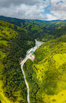 La linea highway weaving through lush Colombian mountains