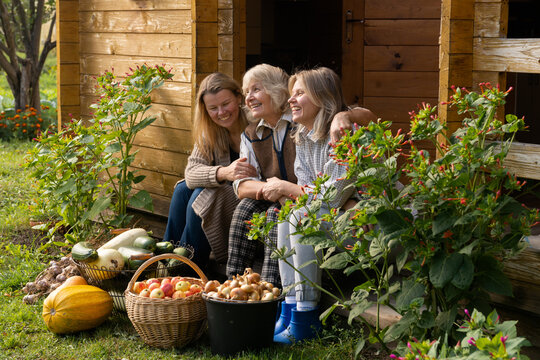 Family bonding in a garden surrounded by fresh produce