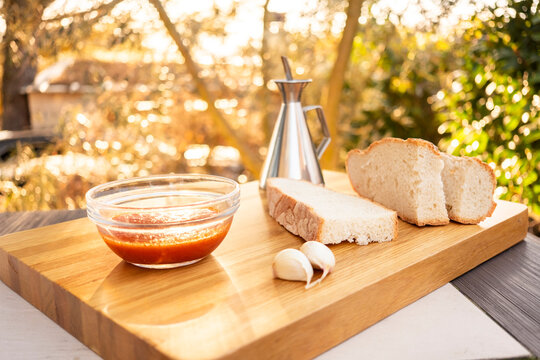 Rustic breakfast scene with bread and condiments