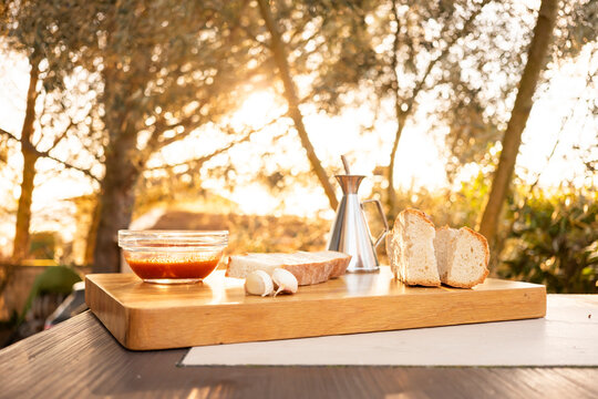 Rustic bread with tomato, oil and garlic on board