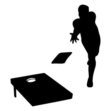 Man aiming for target in cornhole