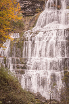 Cascades du Herisson waterfall in autumn foliage