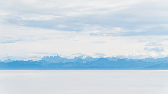 Serene view of the Dents du Midi under a cloudy sky