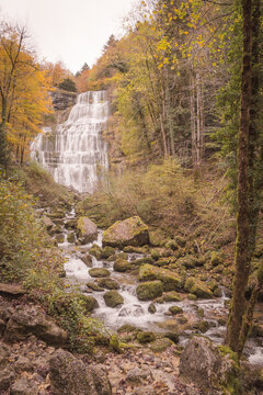 Cascades du Herisson waterfall in autumn landscape