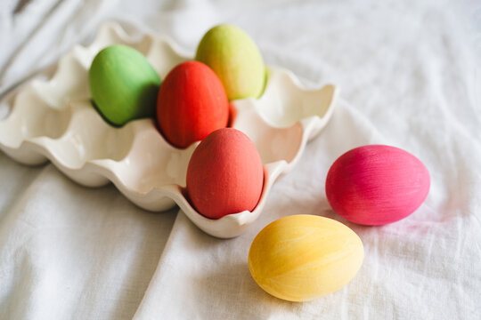 Colorful easter eggs on white cloth background