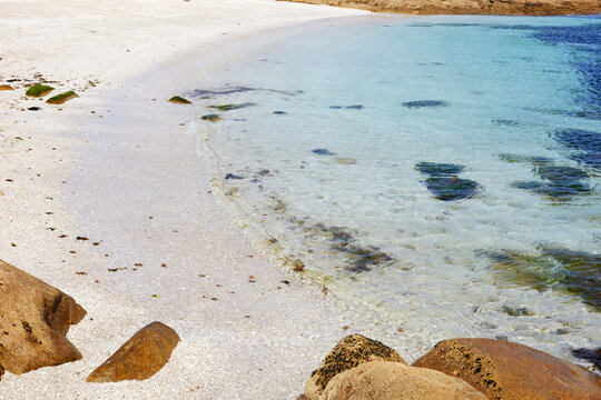 Pristine shore of Cies Islands with clear blue waters