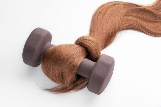 Hair strength concept with weight and flowing locks