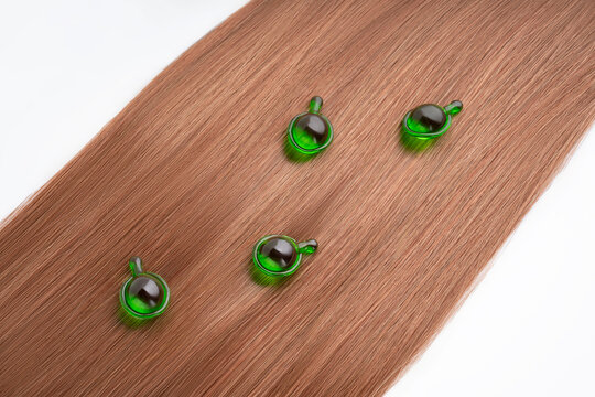 Hair care serum in vibrant green capsules