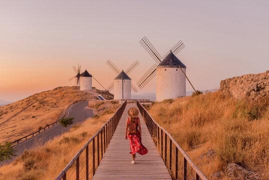 Woman exploring windmills in Consuegra, La Mancha