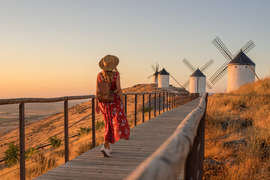 Woman exploring windmills in Consuegra, La Mancha, Spain