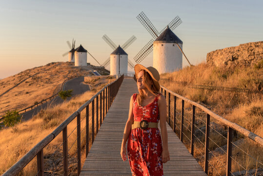 Woman exploring windmills in Consuegra, La Mancha
