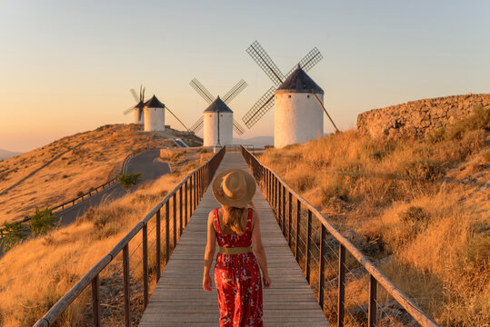 Woman exploring windmills in Consuegra, La Mancha