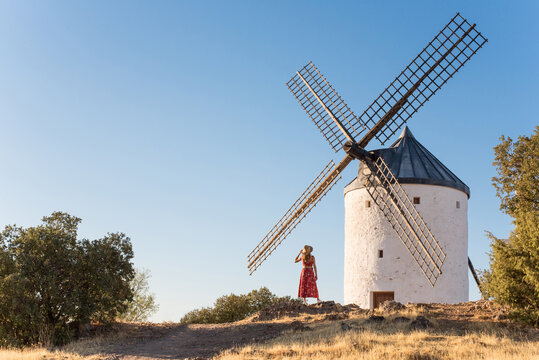 Woman exploring La Mancha windmills in Herencia