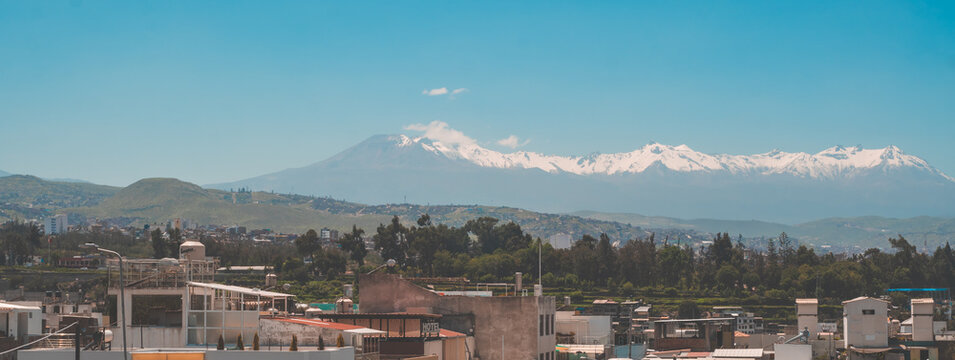 Panoramic view of the city of Arequipa, Peru with several volcanoes in the background