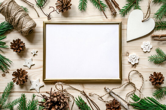 Golden frame christmas mock-up with spruce branches