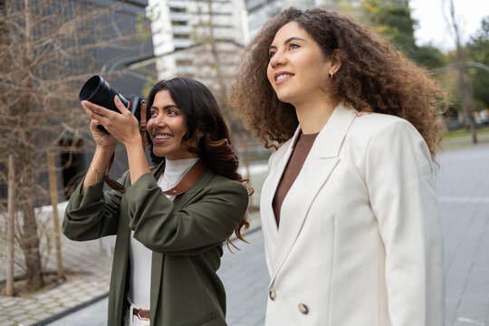Women collaborating outdoors with a creative vision