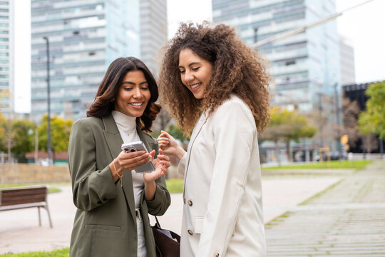 Women sharing a moment in a business setting