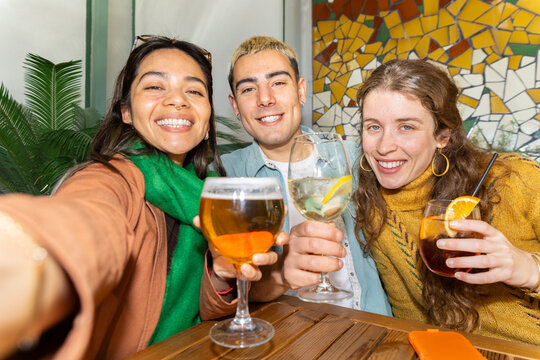Friends enjoying drinks and tapas together