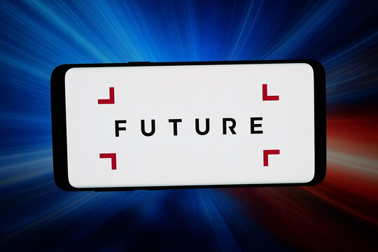 Stuttgart, Germany - 03-18-2026: In this photo illustration, the logo of British publishing company Future plc is displayed on a smartphone in front of abstract background on computer screen.