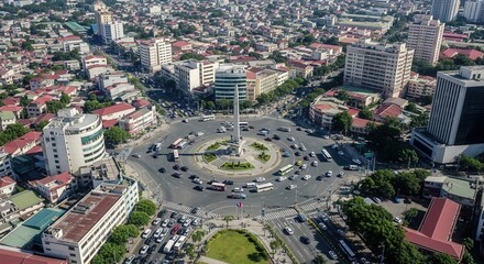 Naklejka premium Bustling Cityscape With Monument And Traffic In A Circular Intersection