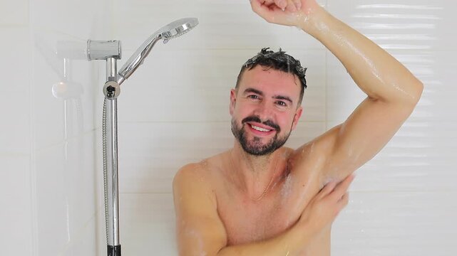 Man using natural soap in the shower 