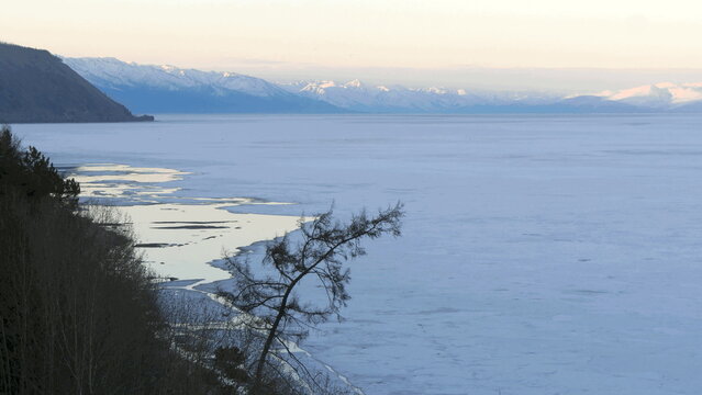 The icy shore of Lake Baikal in Russian Siberia in late spring. The northernmost point of Lake Baikal is located in the small town of Nizhneangarsk.
