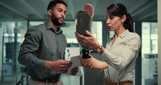 Research, woman and man in lab with prosthetic leg, development and innovation in robotic science. Future technology, medical engineering and team with product solution for artificial limb design