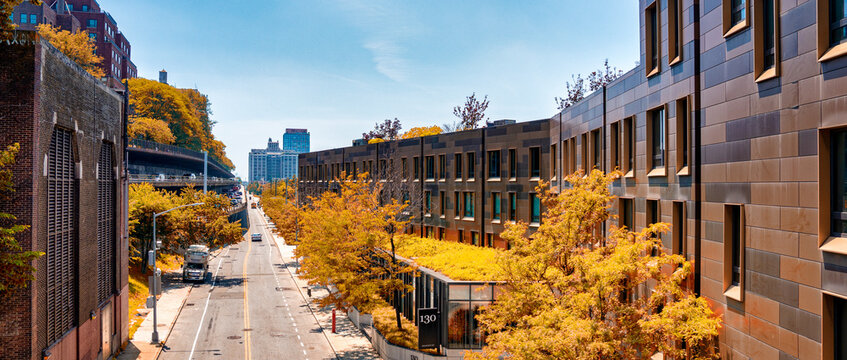 Brooklyn cityscape showing apartment buildings integrated with green spaces and tree-lined streets
