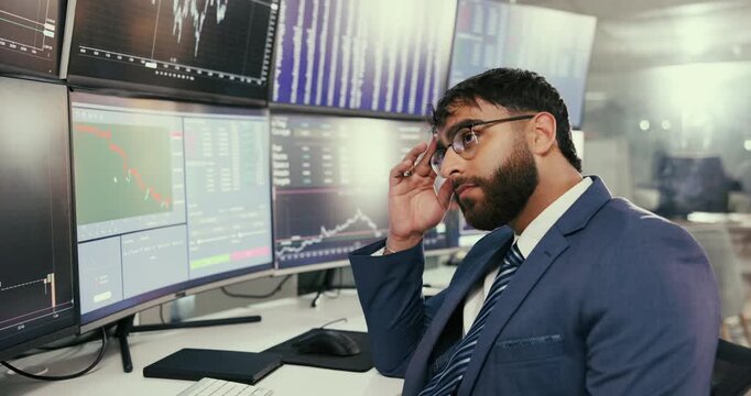 Frustrated businessman, trader and screen with stock market for trading, bad investment or foreign exchange at office. Young man, broker or investor with stress for crash, risk or plummet on computer