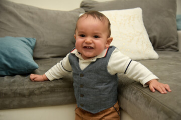 Fototapeta premium young baby taking its first steps