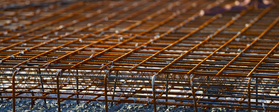 Detailed steel reinforcement cage structure ready for concrete pouring at construction site.