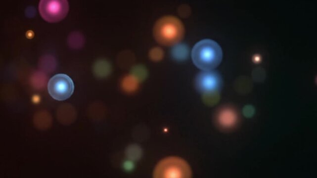Cinematic abstract background with glowing bokeh lights softly drifting across the frame blurred light circles overlapping with warm orange red blue and green hues creating luminous gradients dark bac