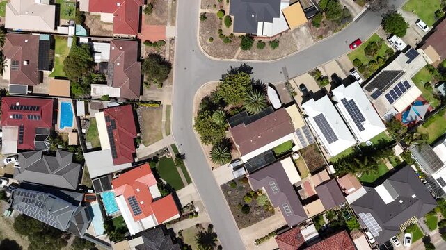 West Lakes, South Australia: 4K aerial drone footage of coastal suburb, housing, estates, low density houses, local streets, solar panels. 