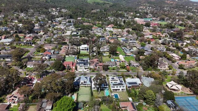 Springfield, South Australia: 4K aerial drone footage of Adelaide Hills suburb, green landscapes, residential houses, tree-covered hills and scenic countryside near Waite campus, Waite Arboretum