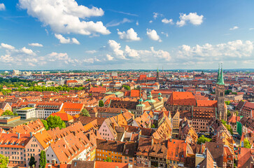 Obraz premium Nuremberg cityscape, aerial panoramic view of old town Nuremberg city historical center with colorful medieval buildings, St. Sebaldus Church towers, Middle Franconia region, Bavaria state, Germany