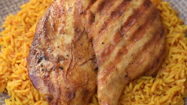 Kabsa or haneeth, an Arabic dish with rice and chicken, salt, and spices. Kabsa or haneeth as a food background for your design