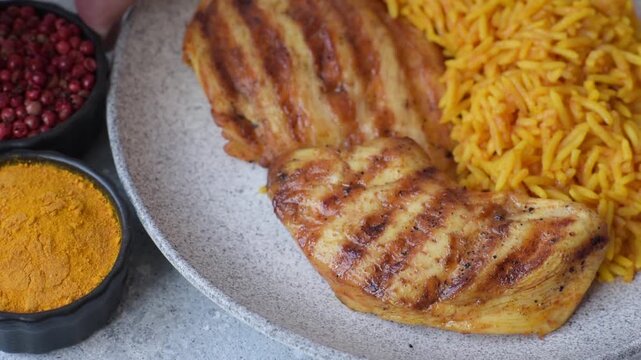 Kabsa or haneeth, an Arabic dish with rice and chicken, salt, and spices. Kabsa or haneeth as a food background for your design
