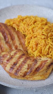 Kabsa or haneeth, an Arabic dish with rice and chicken, salt, and spices. Kabsa or haneeth as a food background for your design